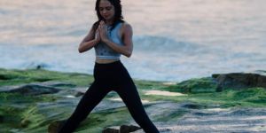 Woman doing yoga outside.