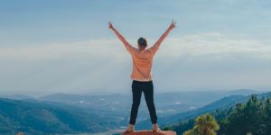 Person on top of a world looking at the view.