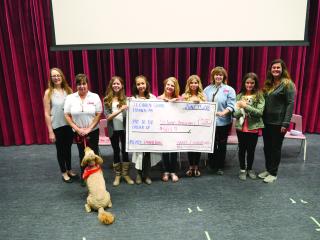 Group of people in Alberta with cheque given to therapy dog program
