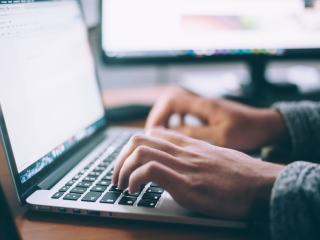 Man hands on laptop