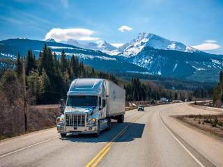 Transport truck on highway. Photo by VanveenJF on Unsplash