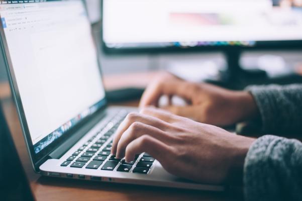 Man hands on laptop