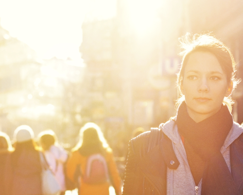 Woman with sunburst behind her