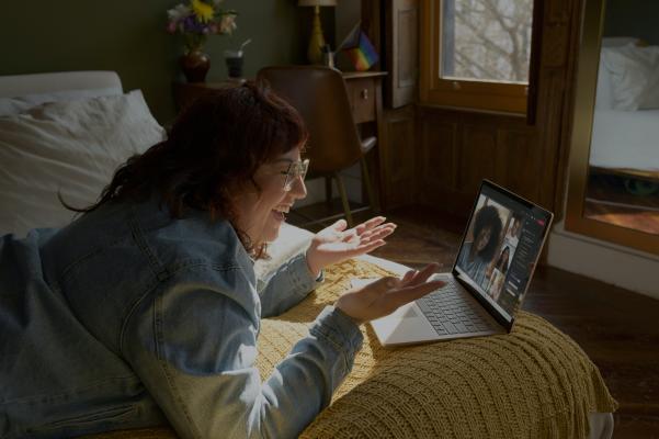 Woman on laptop smiling