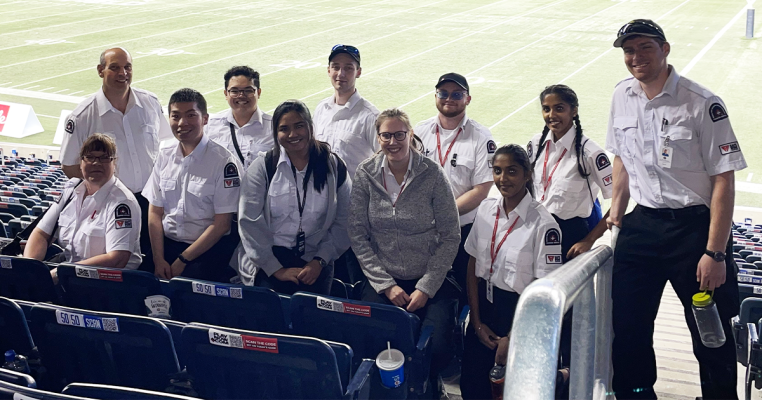 A Group of Volunteers with White Shirt at the Investor Group Stadium