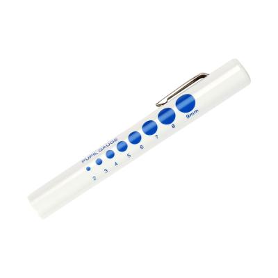 White disposable penlight with blue pupil gauge