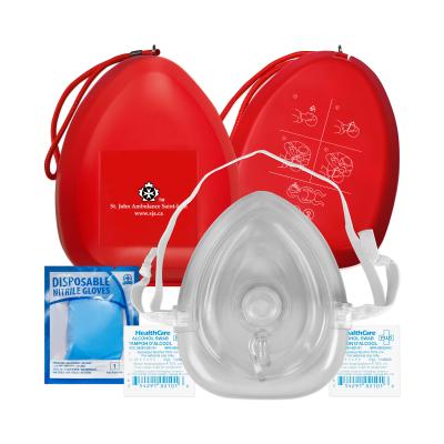 Red CPR Compact Mask with contents displayed in front of the case.