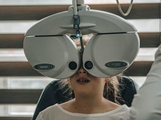 Girl getting eye exam.